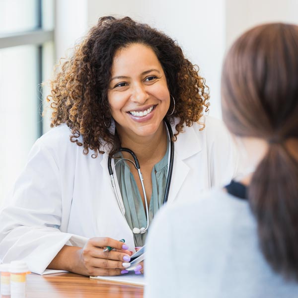 female doctor talking to patient